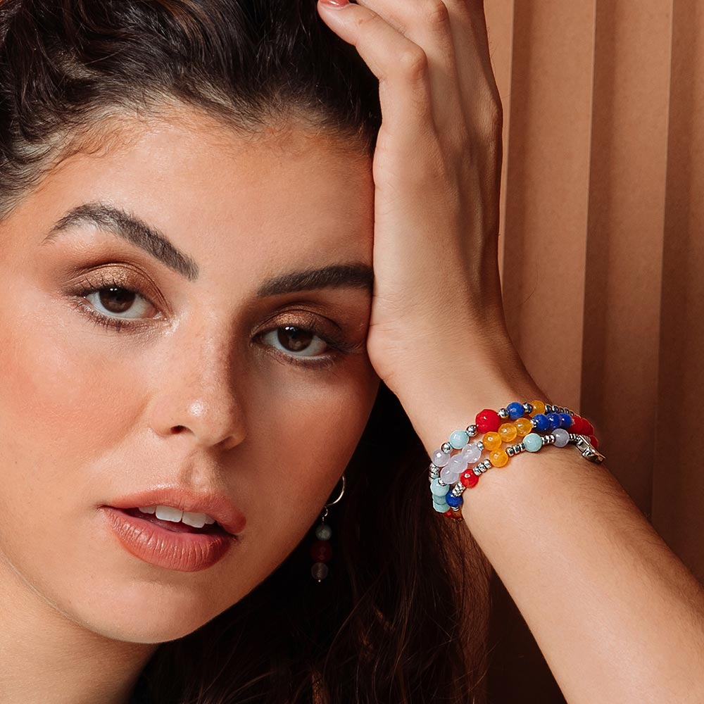 Bianka beaded stone bracelet set with initials on left hand up on forehead