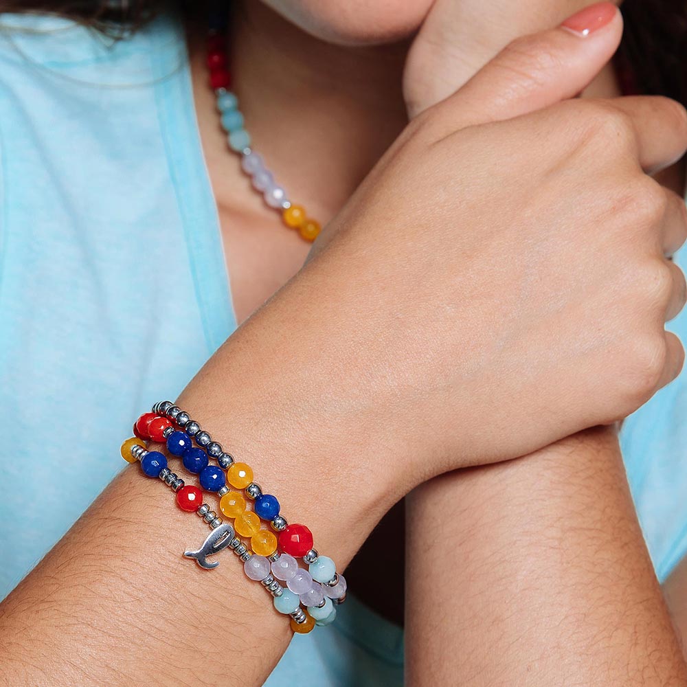 Bianka beaded stone bracelet set with initials on right arm close up