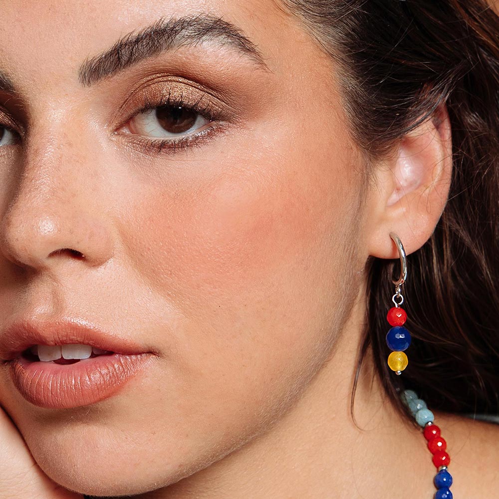 Bianka hoop earrings with mixed stone drops left ear close up.