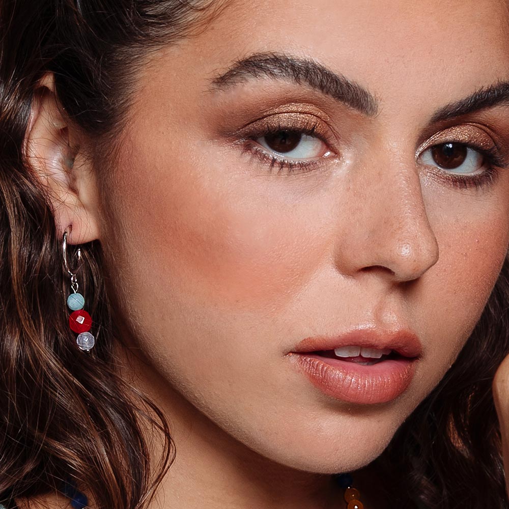 Bianka hoop earrings with mixed stone drops on right ear.