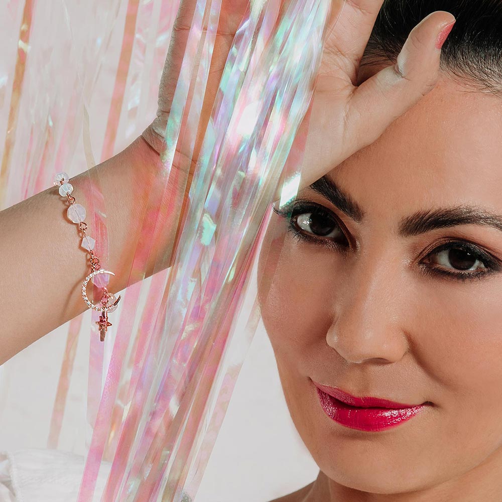 Callista moon and star bracelet worn on right hand up to face