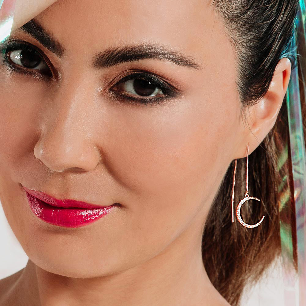 Callista rose gold moon earrings on left ear