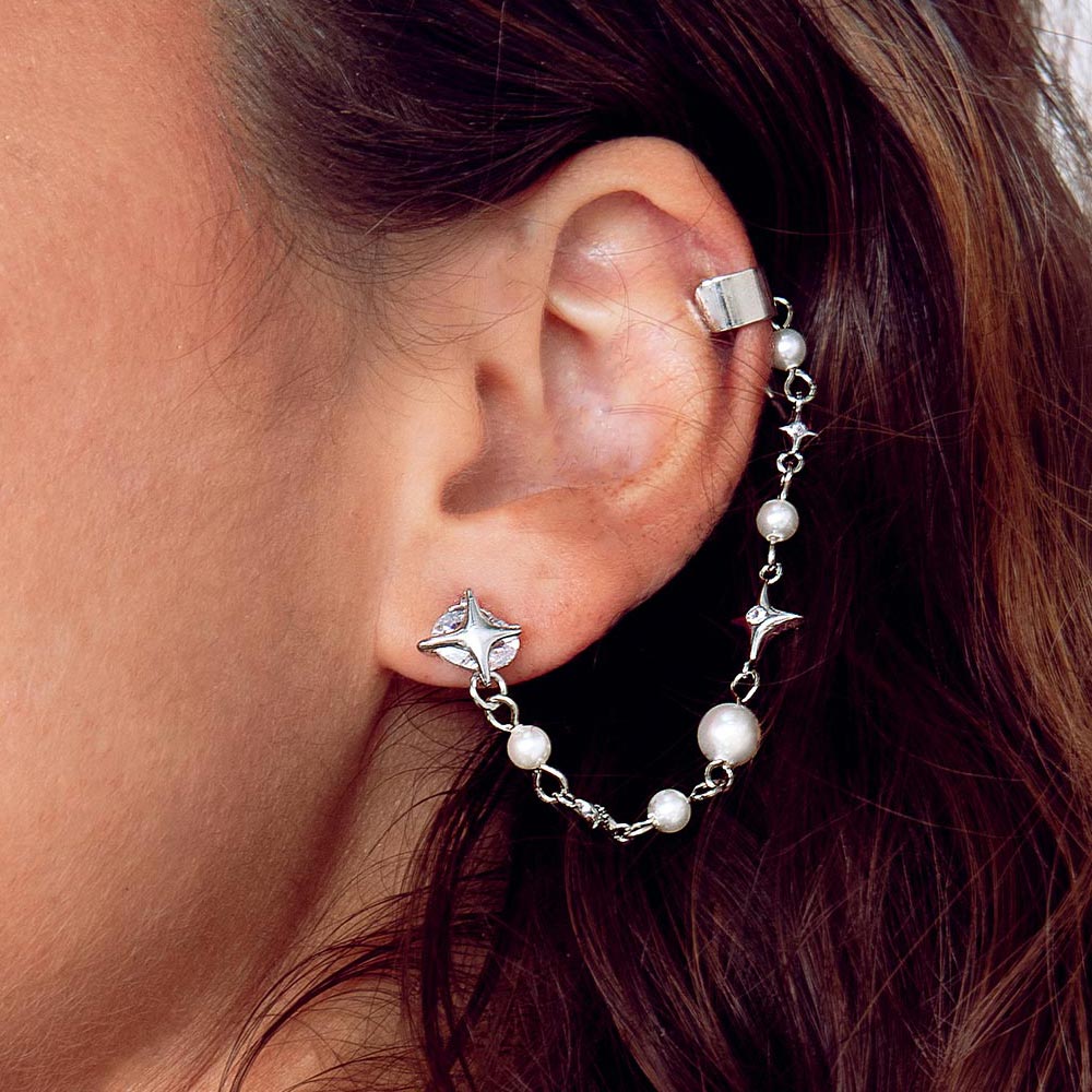 Duchess celestial silver and pearl earring cuff on left ear close up.