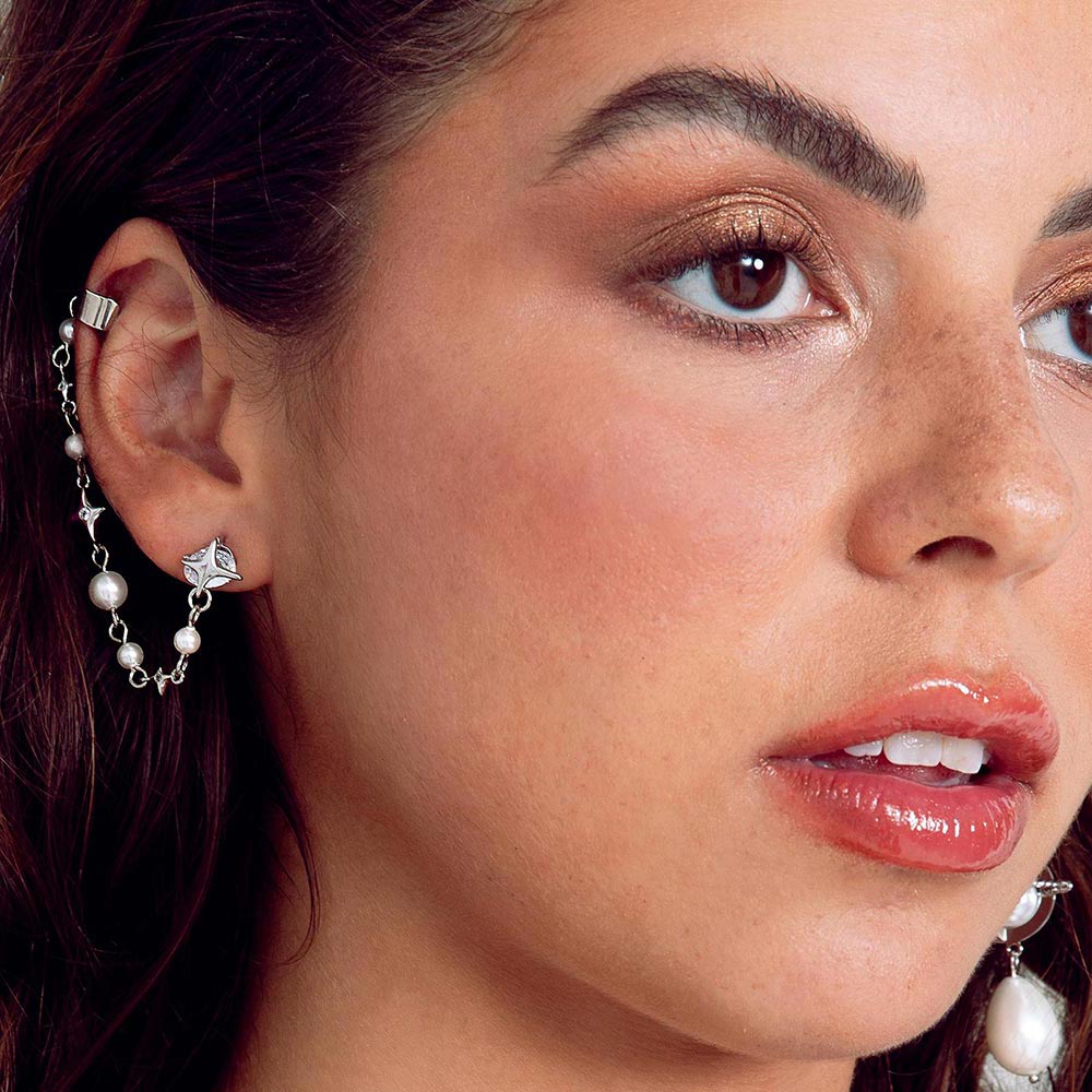 Duchess celestial silver and pearl earring cuff worn on the right ear.