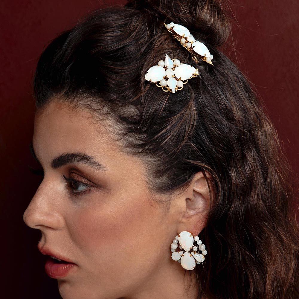Imogen white opal gold wedding hair clips worn on left side hair half up.