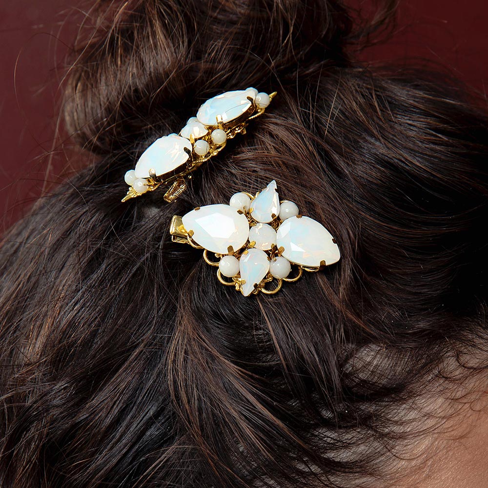 Imogen white opal gold wedding hair clips with top bun close up