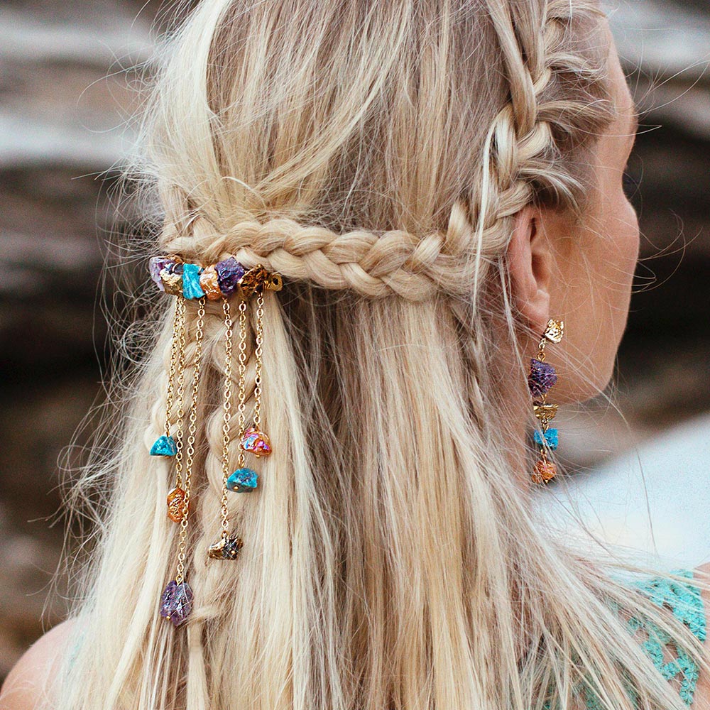 Raye dripping multi-coloured stones hair clip worn with braids from the side-back view