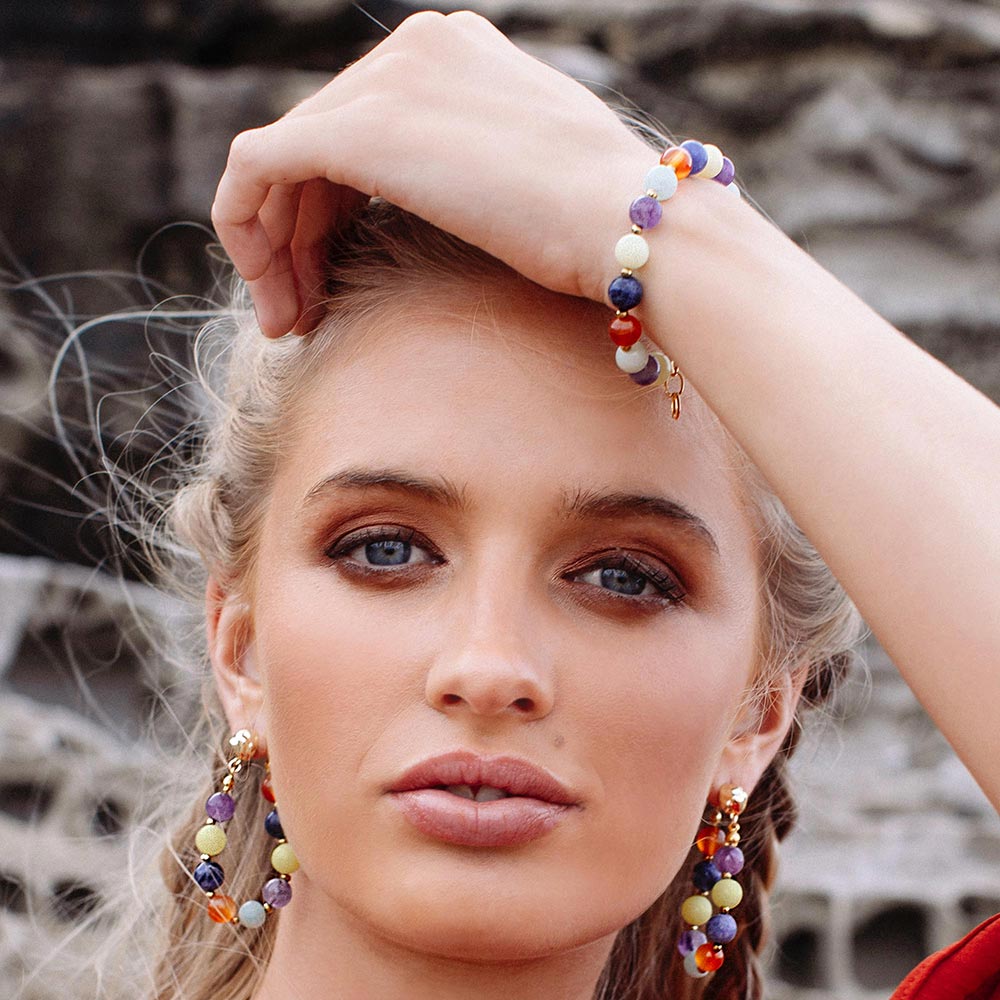 Soleil mixed stone bead bracelet and earrings left arm over head