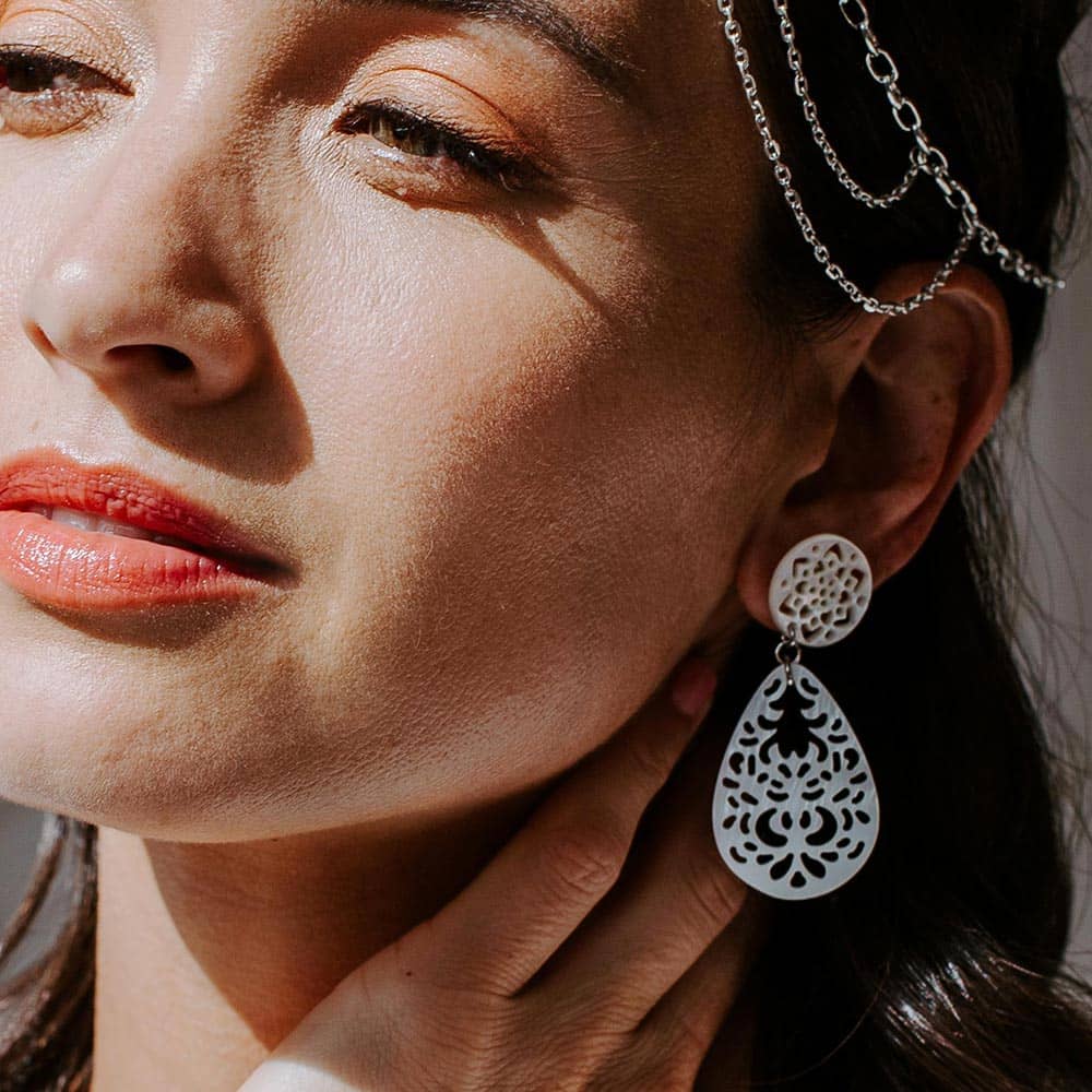 Erykah Lace Shell Earrings left ear shadow