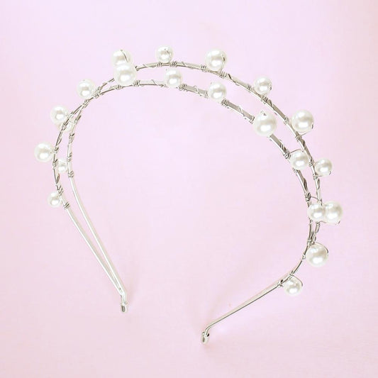 Silver Lulu Double Pearl Bridal Headband on pink