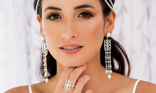 model with white long pearl earrings