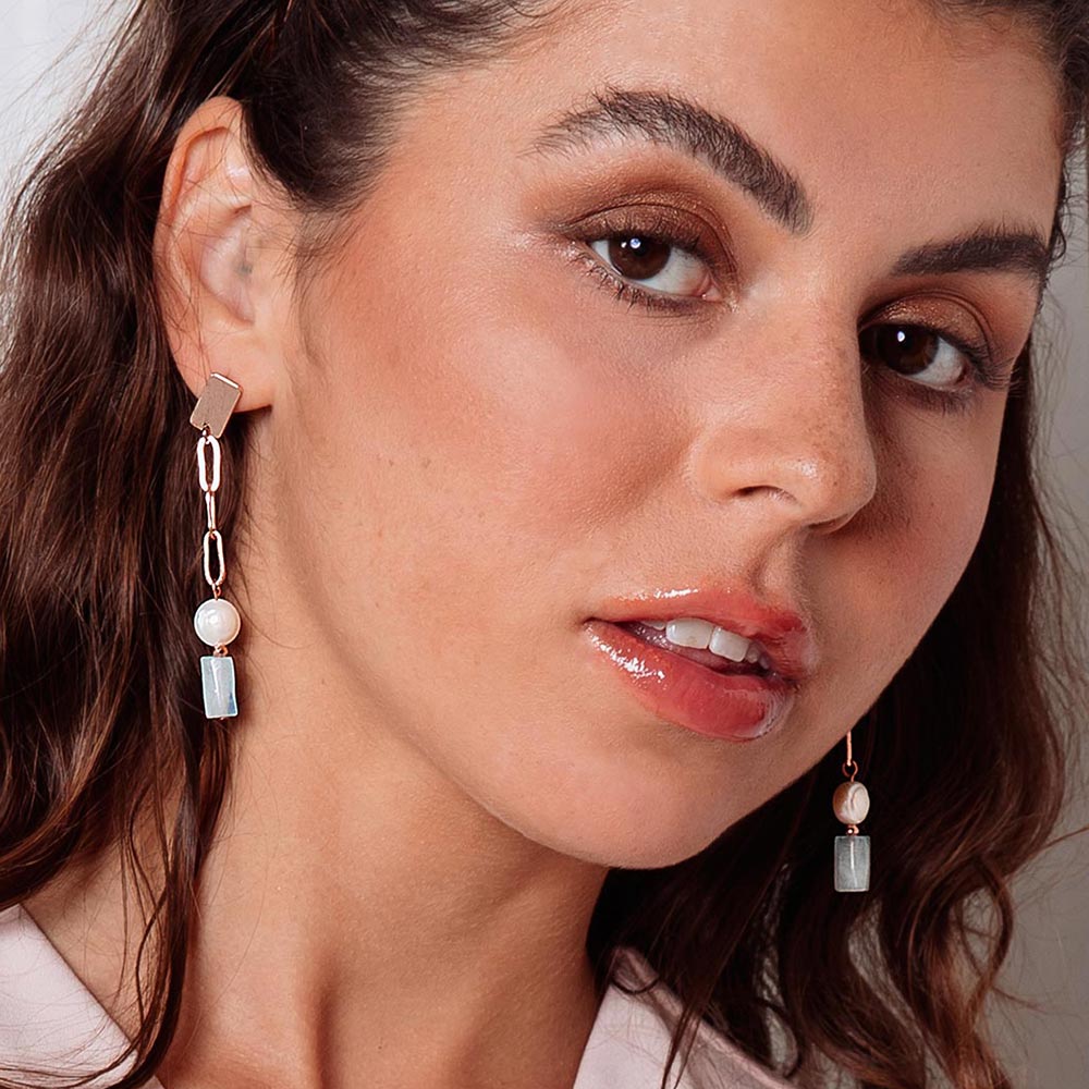 Aimee freshwater pearl and morganite stone earrings right side head tilt.