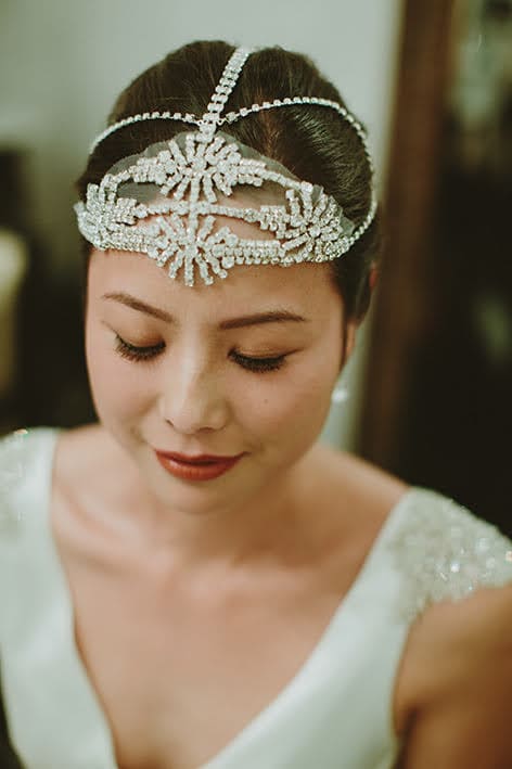Esther wearing a custom white lace and crystal headpiece