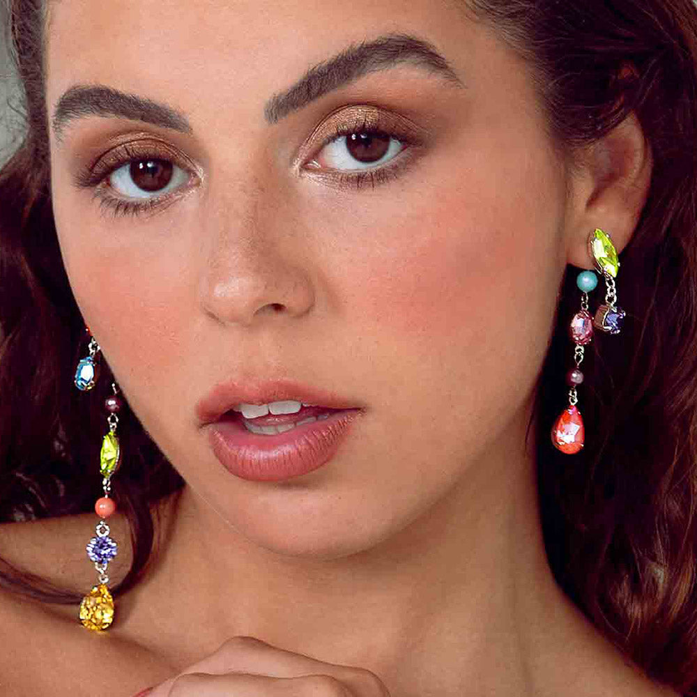 Freda colourful crystal asymmetrical earrings short side on left ear and long side on right ear.