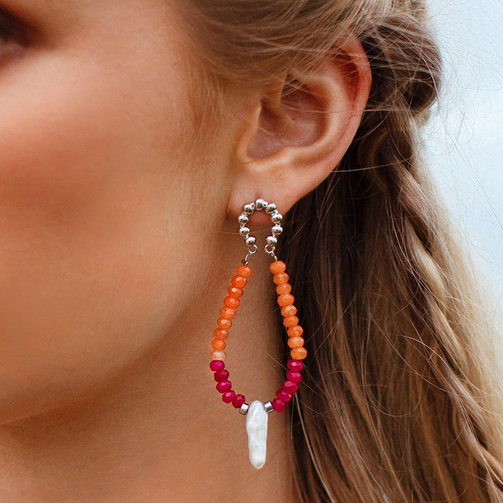 Halley colourful stone and pearl earrings orange fuchsia with silver left ear close up