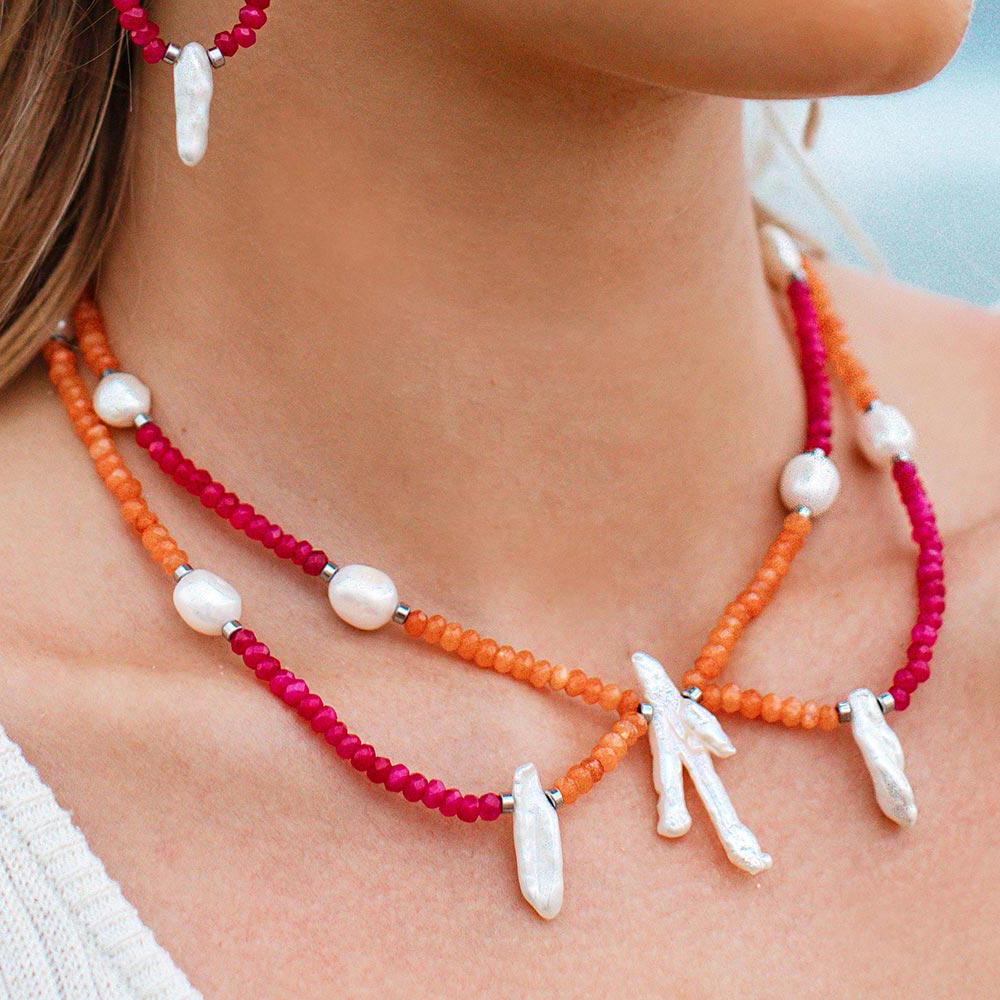 Halley colourful stone bead and freshwater pearl necklace orange and fuschia with silver, close up on neck