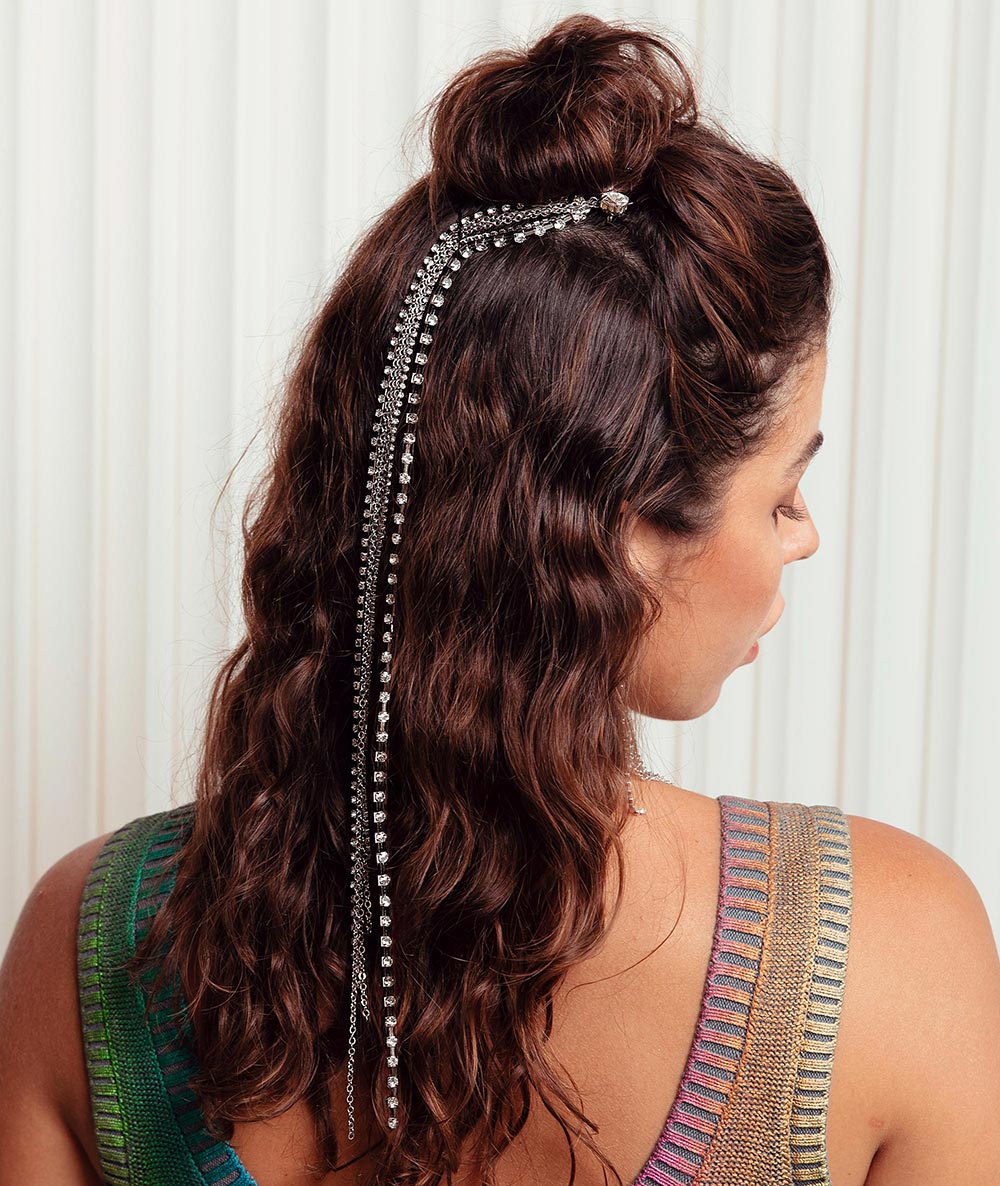 Keisha long rhinestone tassel hair clip around top bun and down the back of head loose curls.