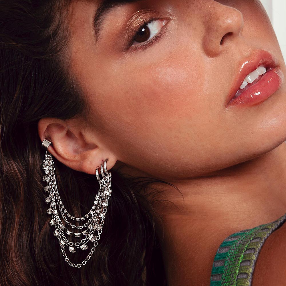 Keisha rhinestone and chain ear cuff earring on right ear head tilt back.