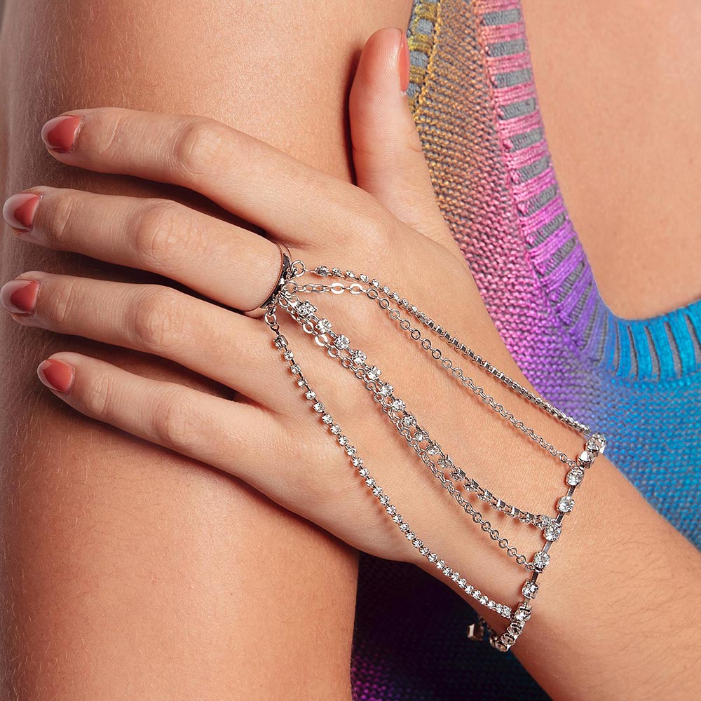 Keisha rhinestone hand chain bracelet on left hand close up.