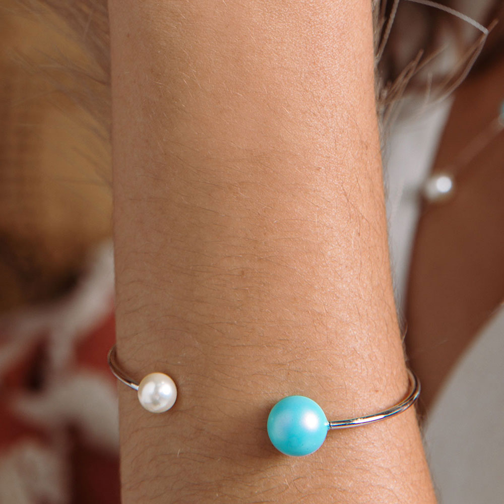 Nerina double pearl cuff bracelet white and blue pearl with silver close up on left arm