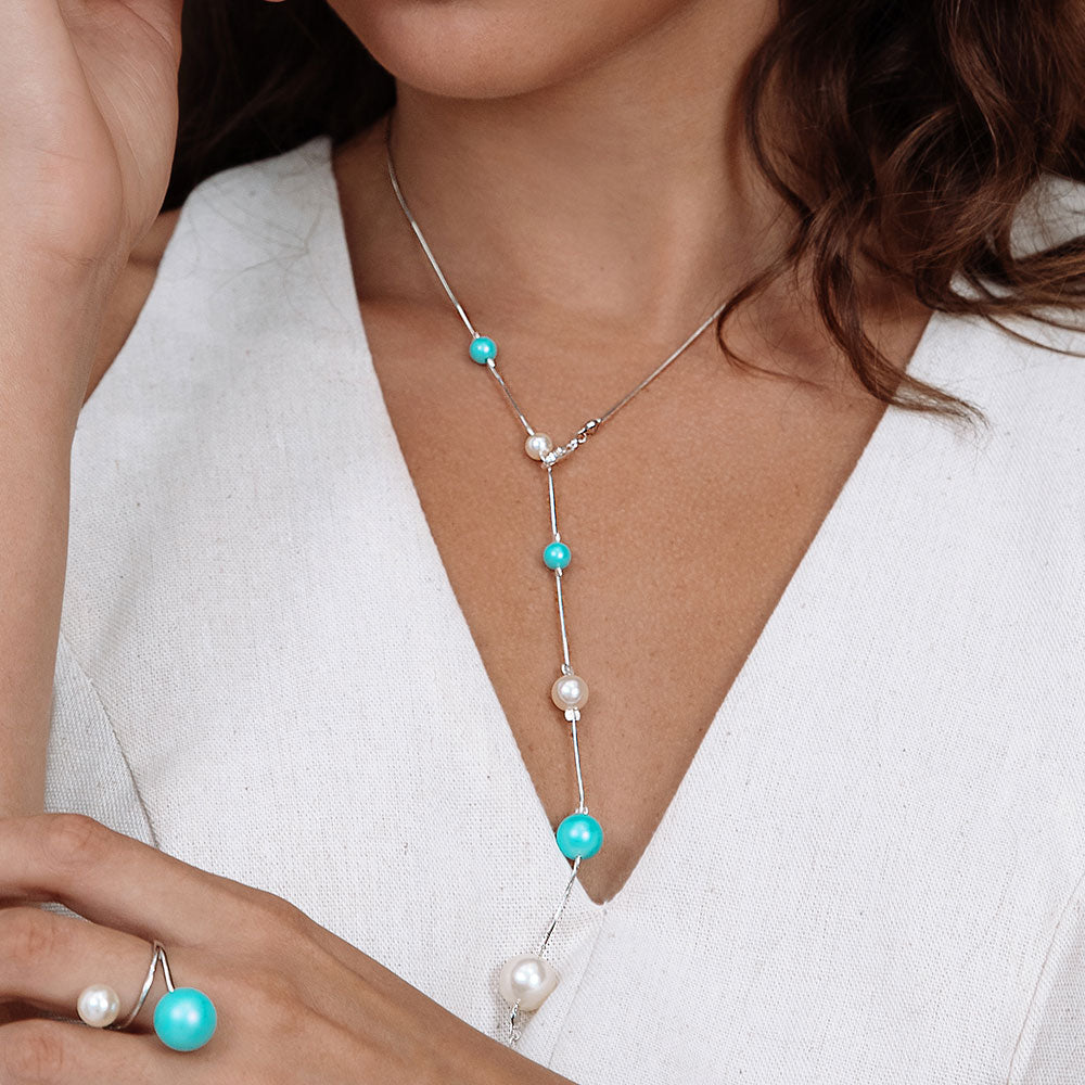 Nerina mixed pearl chain lariat necklace Y style draping over top, worn with Nerina ring