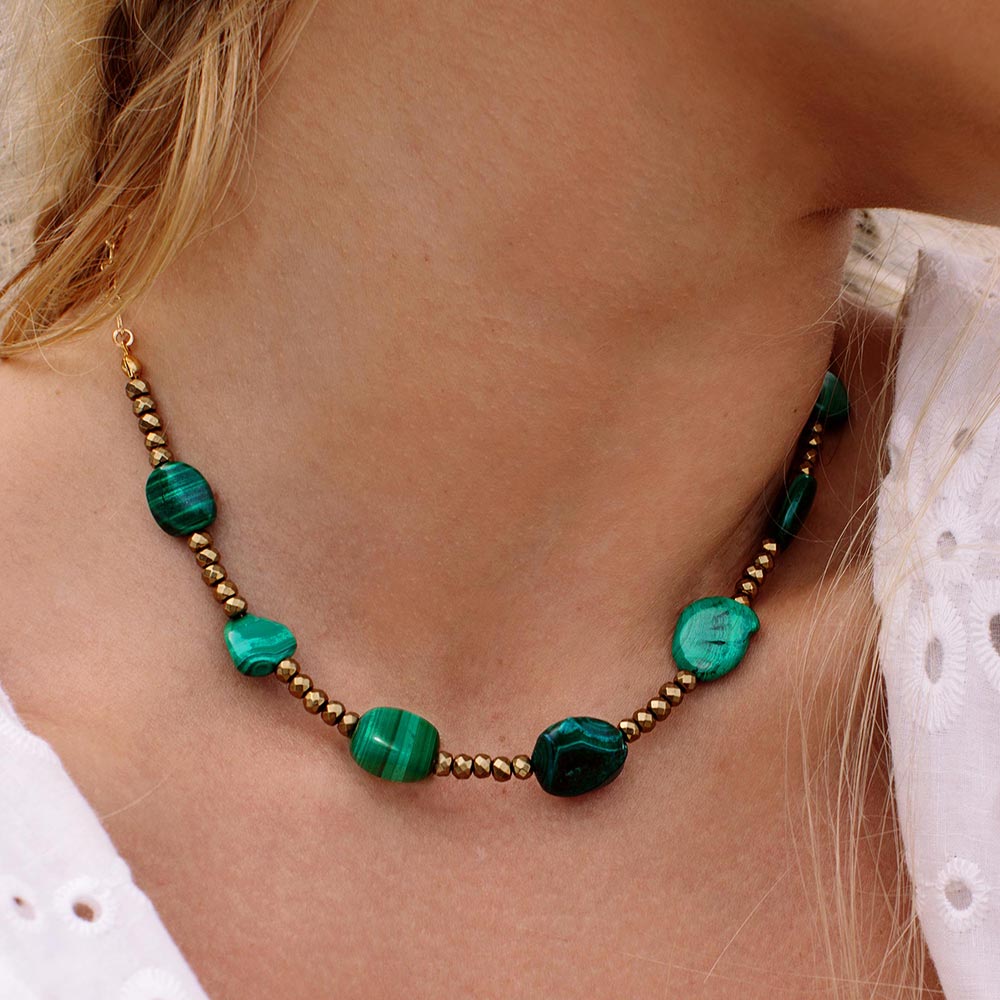 Ursa malachite stone and gold necklace close up
