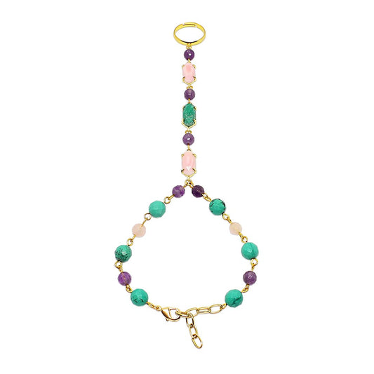 Wylda bohemian slave bracelet ring made with turquoise, amethyst, rose quartz and gold on white background