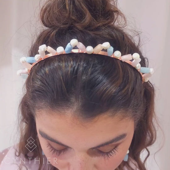 Aimee natural multi-stone crown headband and earrings, woman looking down and lifting her head up.