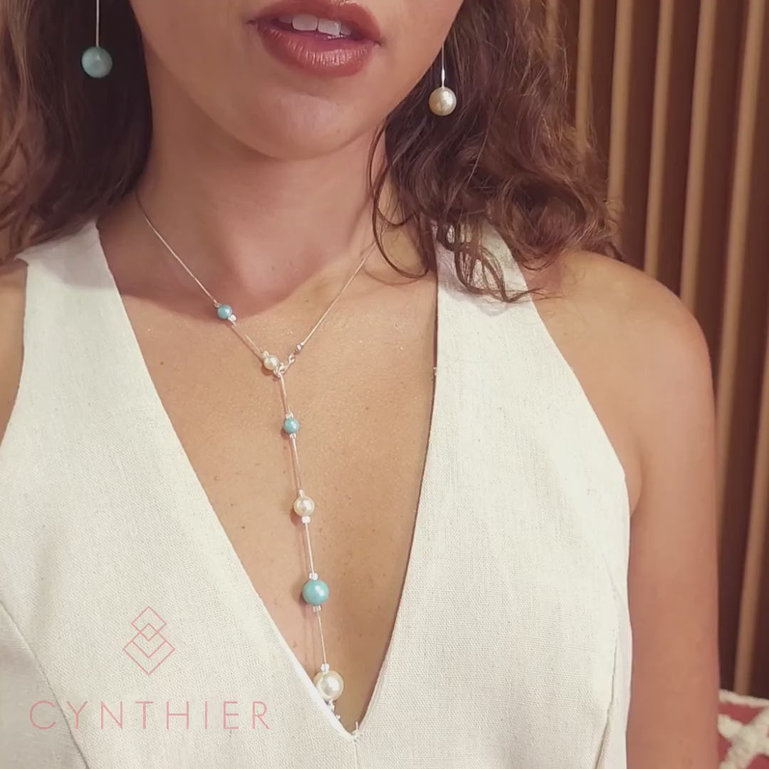 Nerina mixed pearl chain lariat necklace Y style and Nerina mixed pearl earrings worn with low V dress