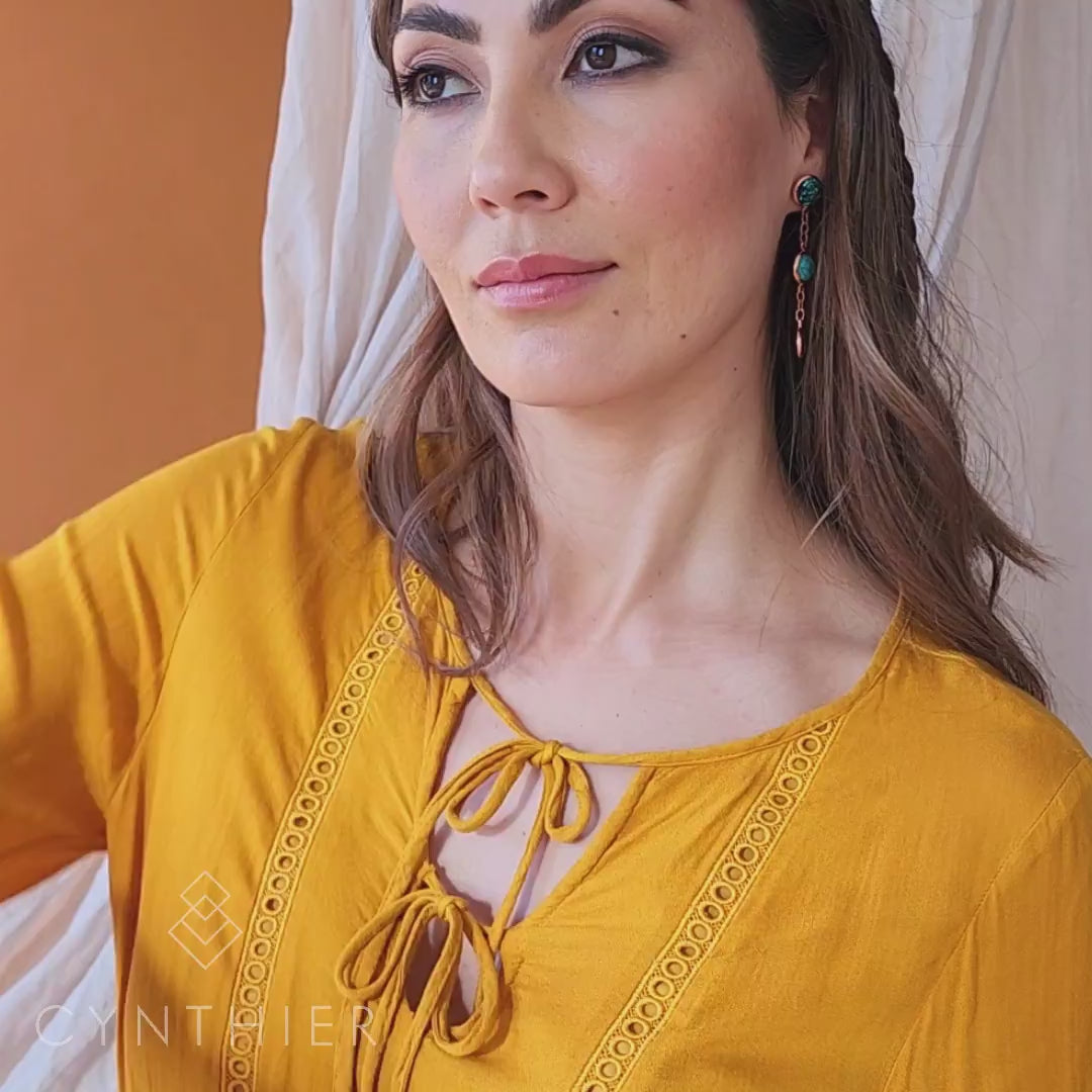 Jorja hand chain multi stone and rose gold worn on right hand, model twirls hand around her head.