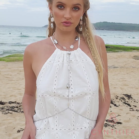 Leora freshwater pearl body chain necklace and earrings, worn at the beach.
