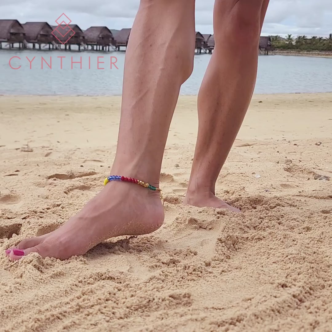 Millie rainbow beaded anklet worn at the beach