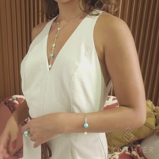 Nerina double pearl set. Ring and bracelet on left arm, rises up along necklace to earrings.