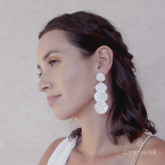 Nixi shell earrings on bride