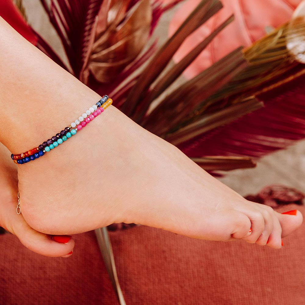 Ashnikko colourful multi stone anklets barefoot on right foot