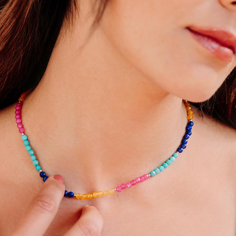 Ashnikko multi colour stone beaded necklace bright colours, hand holding necklace