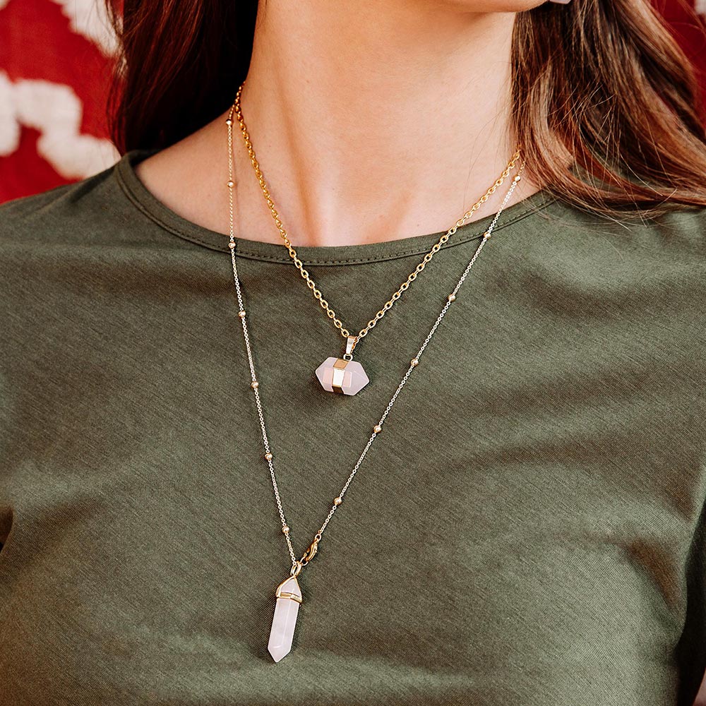 Chakra stone pendant necklaces for layering pink rose quartz and gold close up front