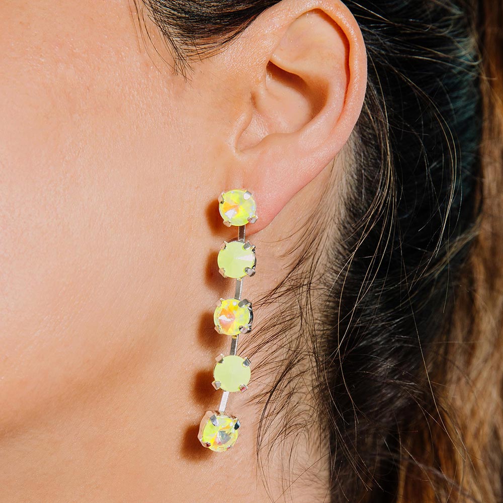 Daiquiri neon crystal earrings, neon yellow left side close up