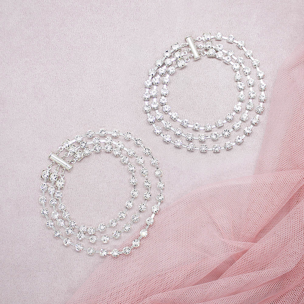 Deva crystal anklets for wedding closed on pink background.