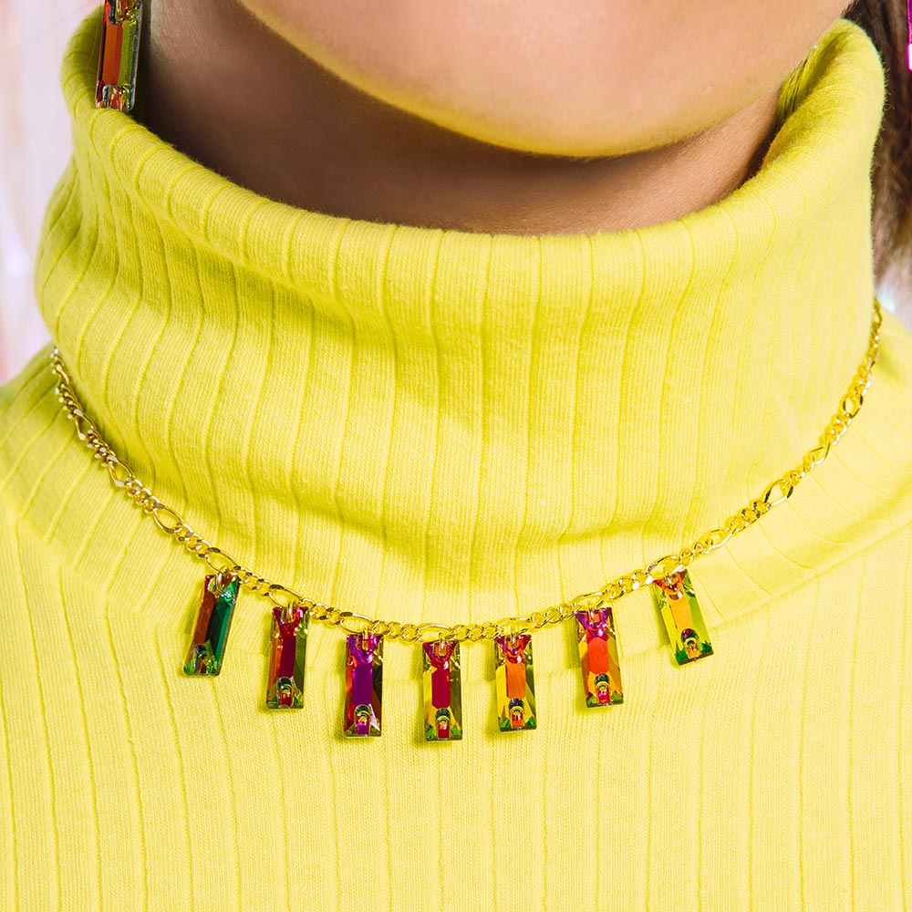 Dylan rectangle crystal necklace rainbow and gold worn with turtleneck top