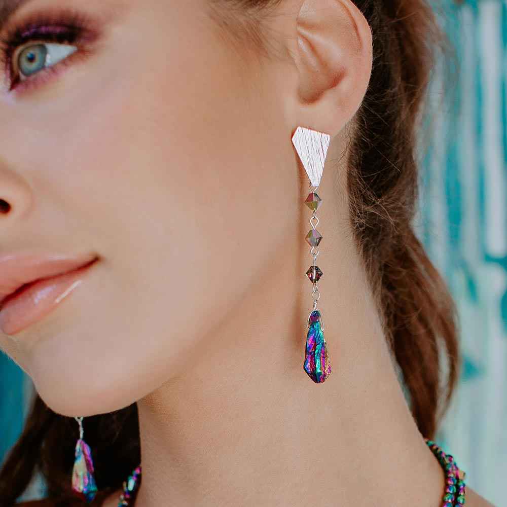 Ecca Quartz Drop Earrings in Metallic Rainbow on left ear