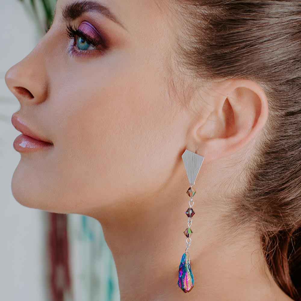 Ecca Quartz Drop Earrings in Metallic Rainbow on left ear
