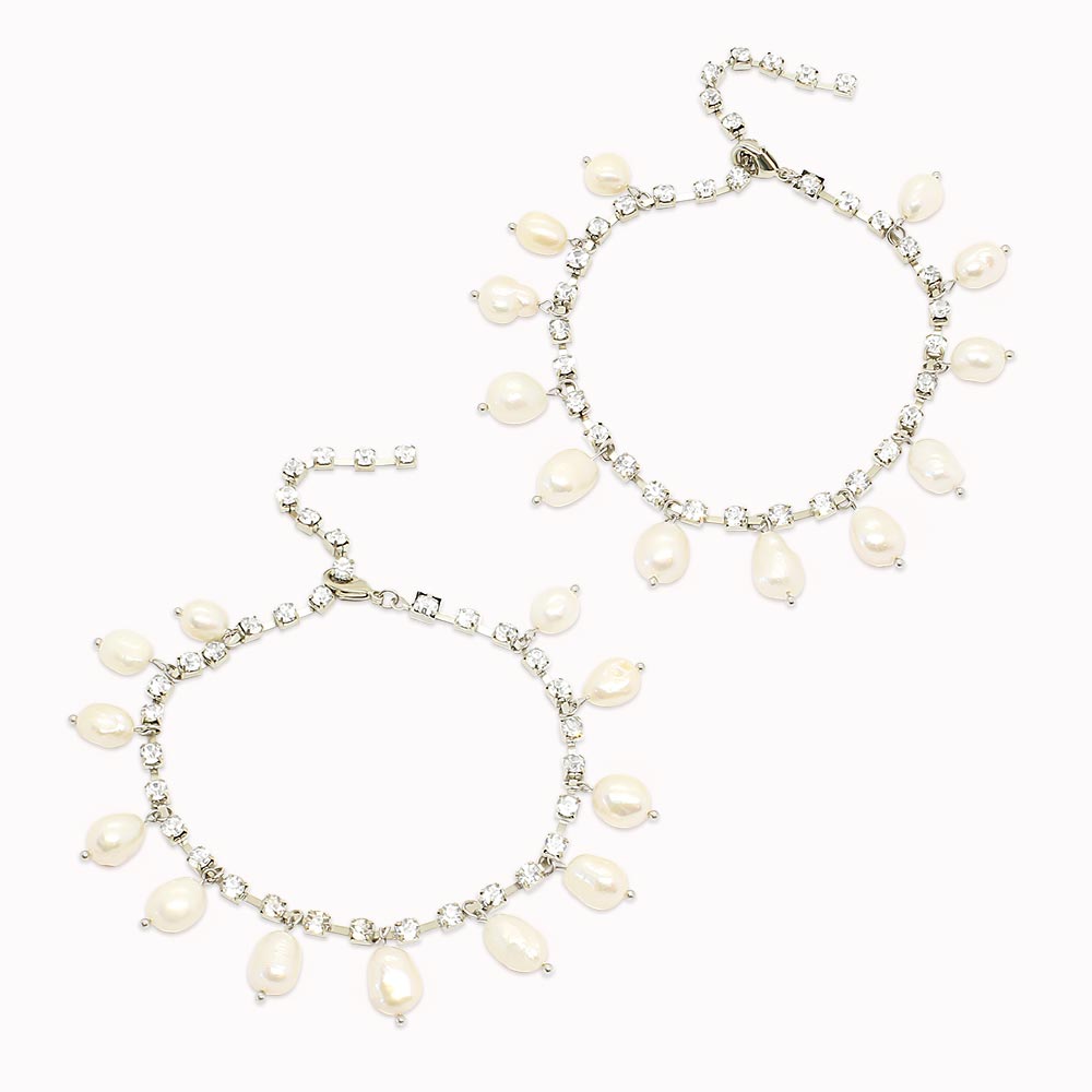 Kaia crystal and freshwater pearl anklets in silver on white background