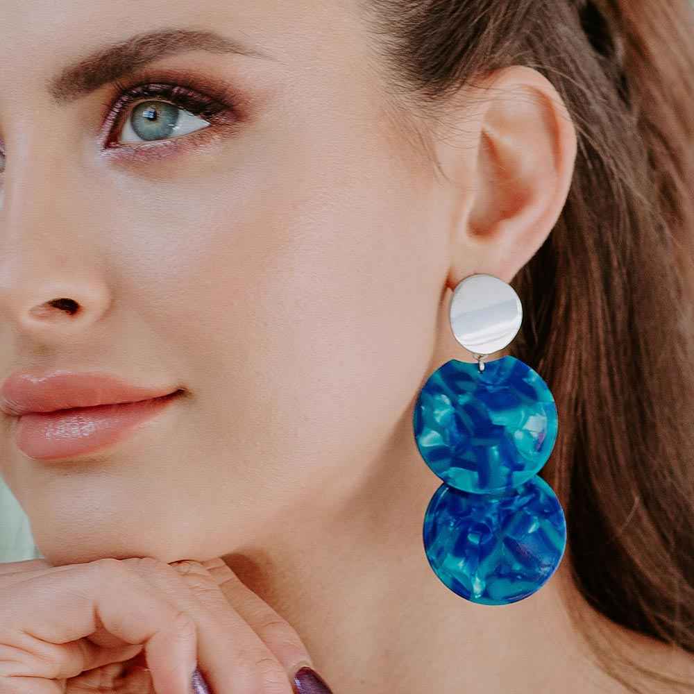 Leya disc dangle earrings Blue on left ear side