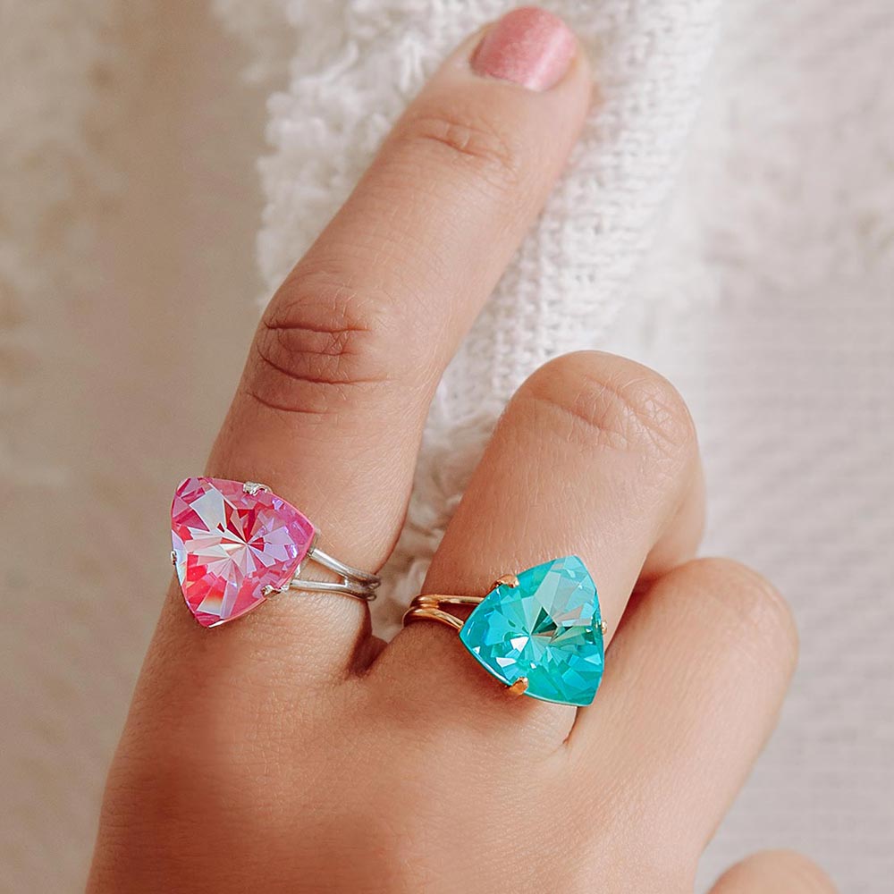 Lissa crystal triangle rings pink and blue close up on hand