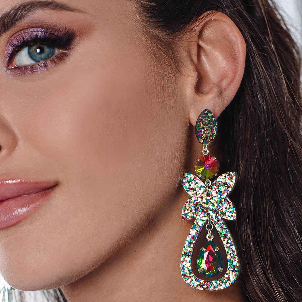 Ophelia Glitter Statement Earrings close up worn on model's left ear