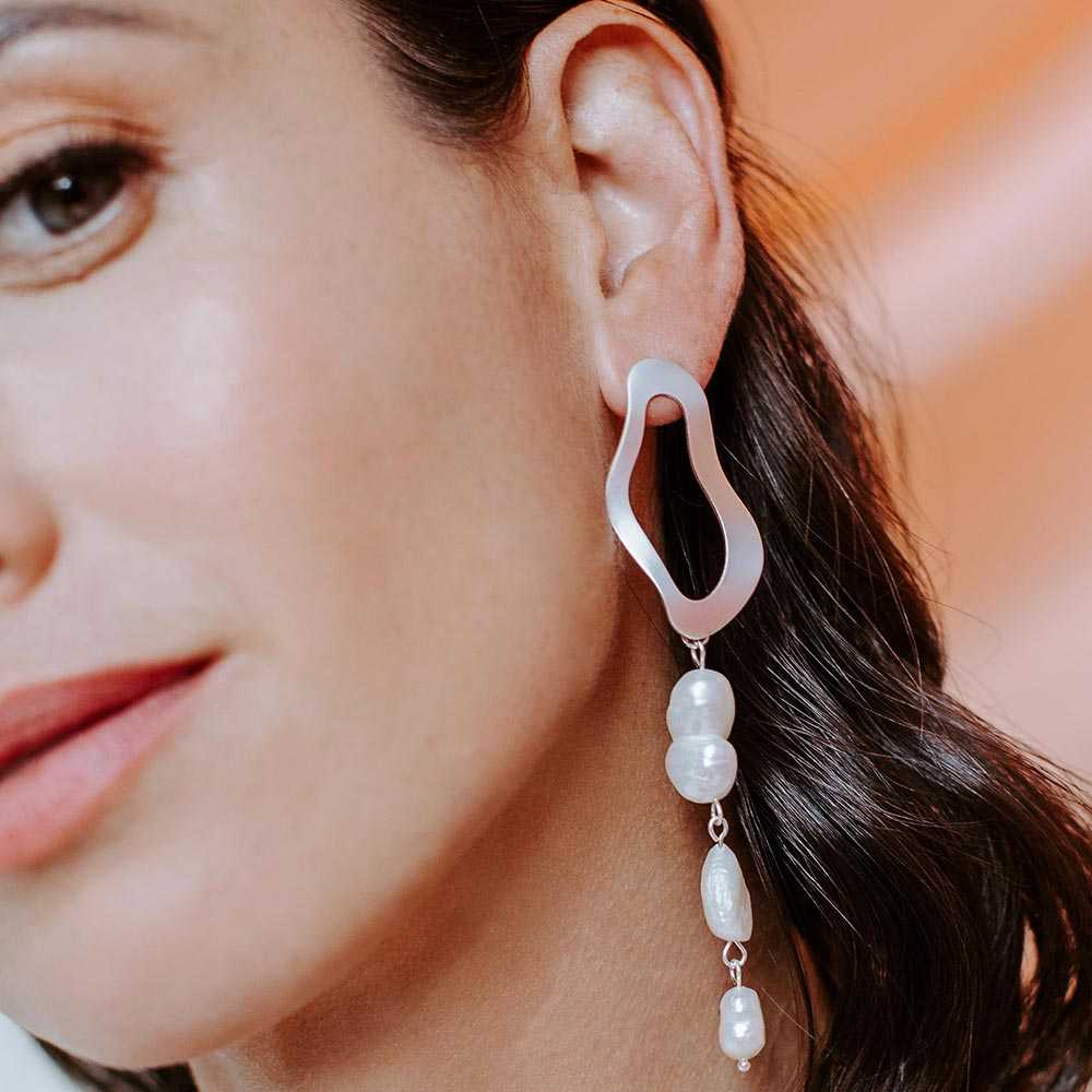 Sadie earrings close up on left ear