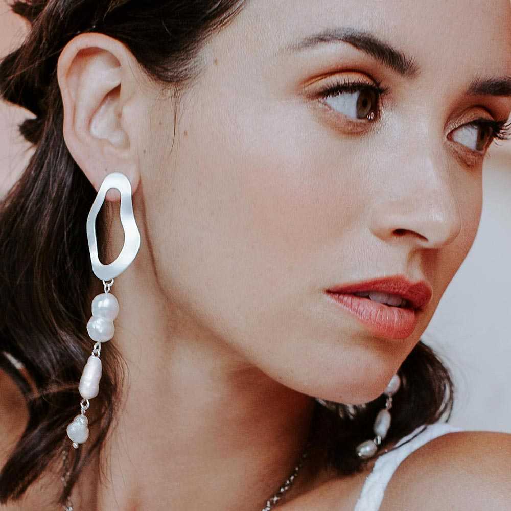 Sadie earrings on right ear