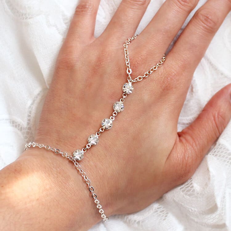 Alek crystal hand chain bracelet in silver on left hand