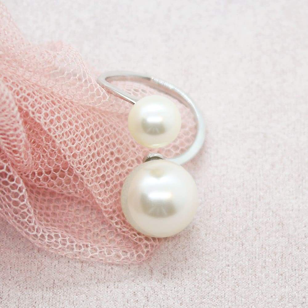 Ivory Calypso Modern Pearl Wrap Ring on pink